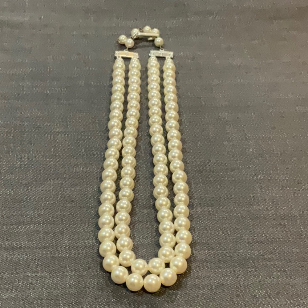 Double strand of faux pearls